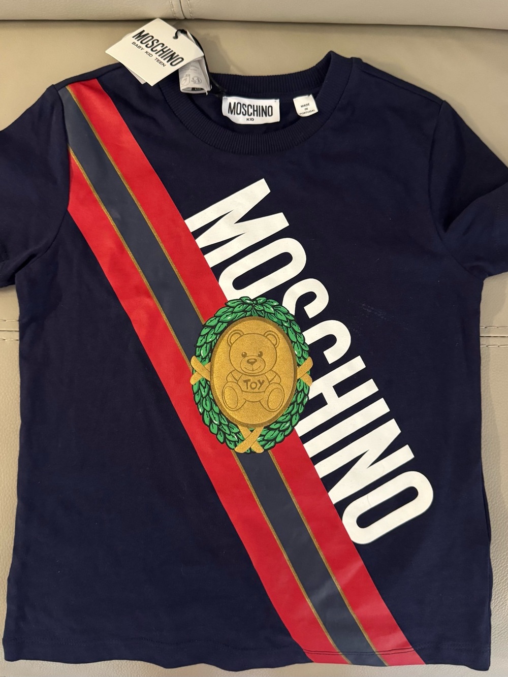 Moschino Navy Tee with Red, Gray & Gold Crest